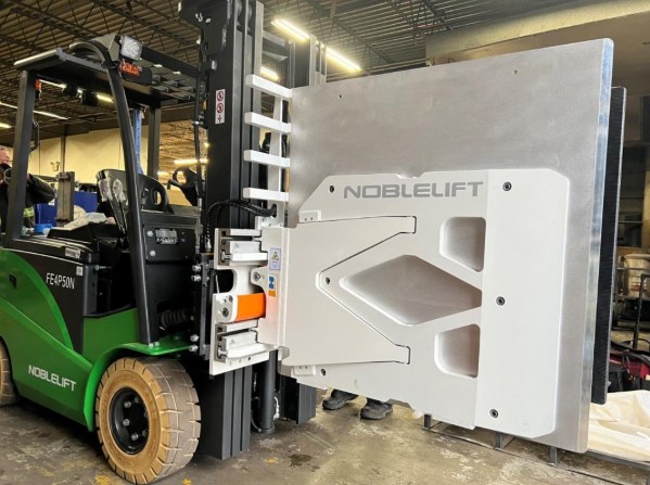 Noblelift FE4P50N electric warehouse forklift with a clamp attachment, supplied and serviced by Noblelift Canada
